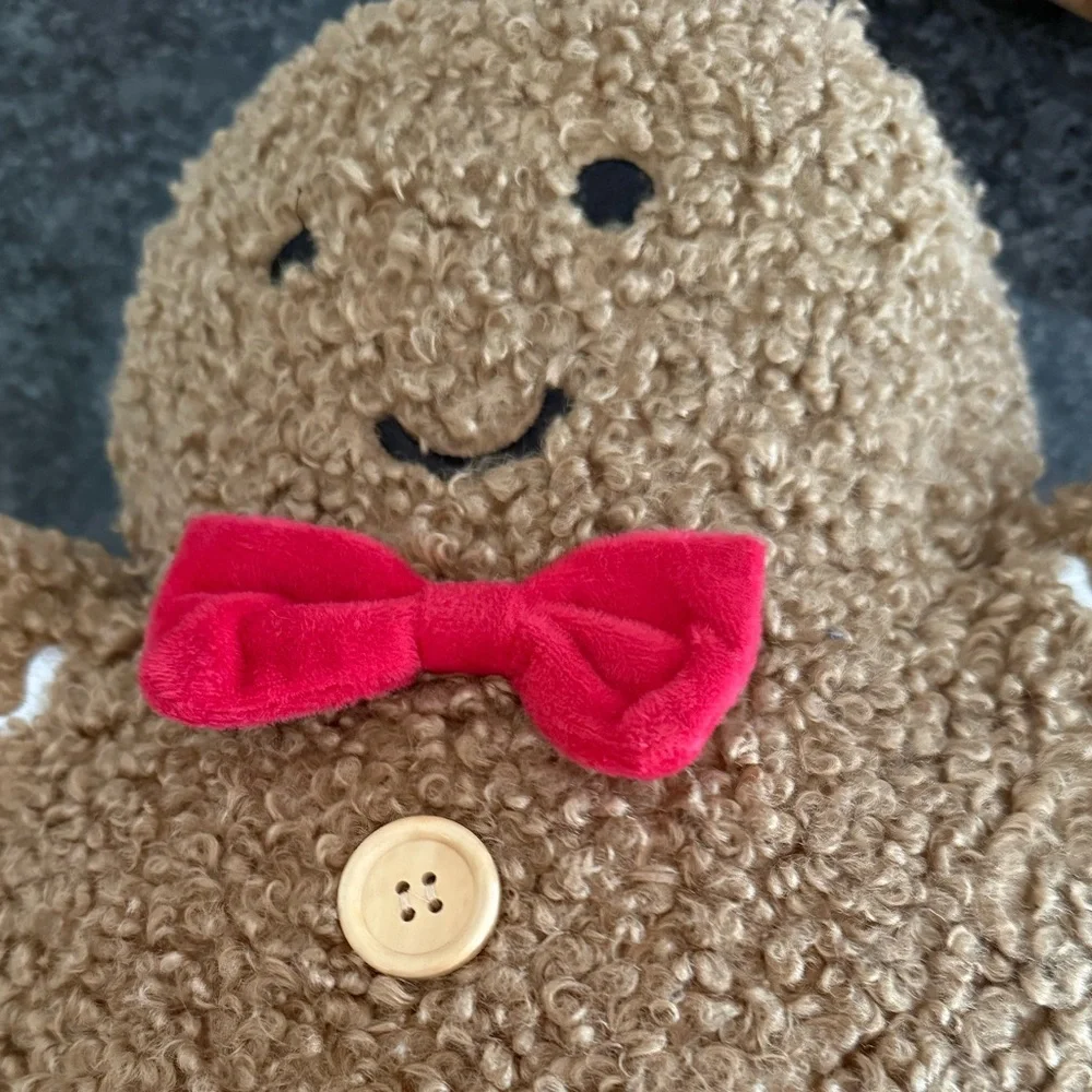 cupcakes & cashmere Brown Gingerbread Plush Holiday Pillow with Red Bow